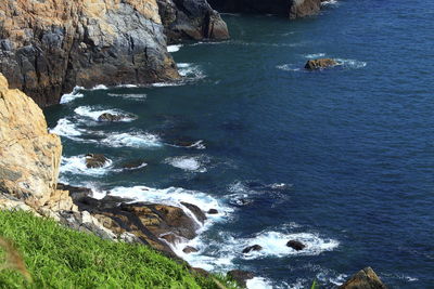 High angle view of rocks on sea