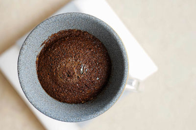 High angle view of coffee cup on table