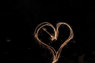 Light painting against sky at night