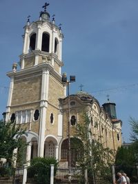 Low angle view of church against blue sky