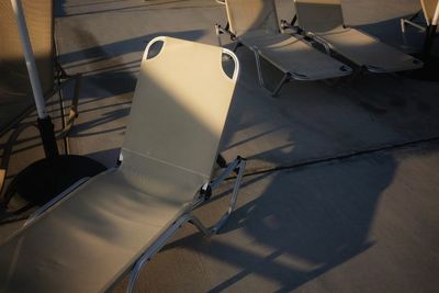 High angle view of chairs on table