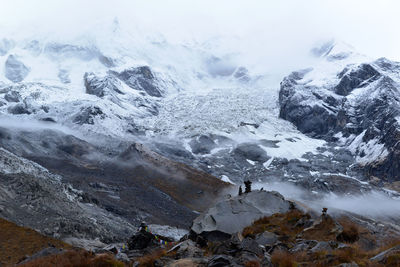 Scenic view of frozen mountain against sky