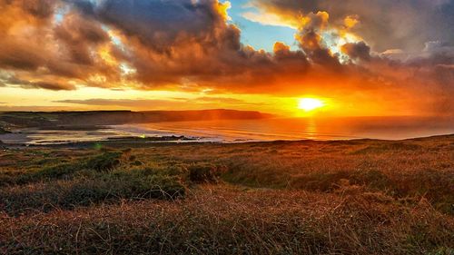 Scenic view of sea against sky during sunset