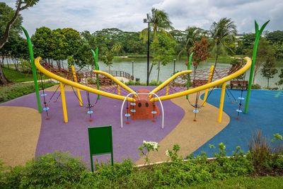 View of playground against trees in park