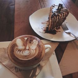 High angle view of coffee served on table