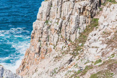 Scenic view of rocks by sea