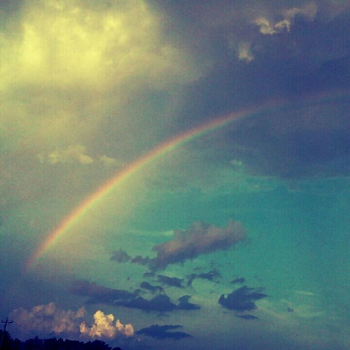 sky, scenics, rainbow, beauty in nature, cloud - sky, multi colored, tranquility, tranquil scene, nature, idyllic, cloudy, weather, landscape, dramatic sky, cloud, outdoors, no people, aerial view, majestic, overcast