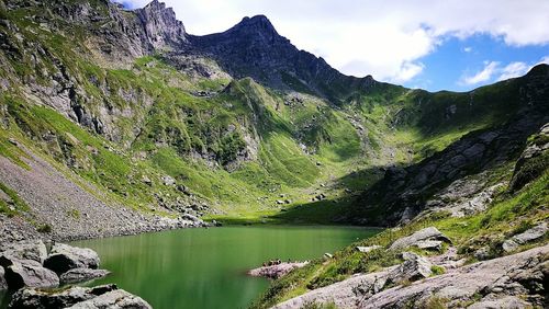 Scenic view of lake by bergamo alps