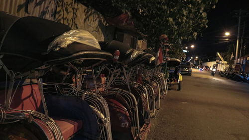 Panoramic view of cars on street at night