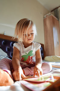 Portrait of cute girl looking away at home