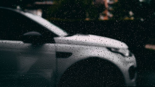 Close-up of wet glass window in rainy season