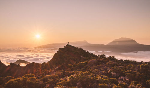 Scenic view of mountains against sky during sunset