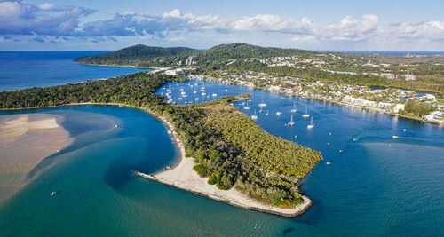 High angle view of sea shore against sky