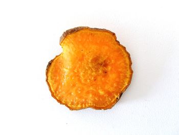 Close-up of orange over white background