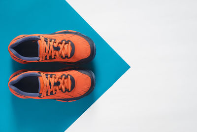 High angle view of shoes against clear blue sky