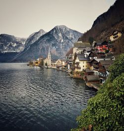 Scenic view of lake and mountains against clear sky