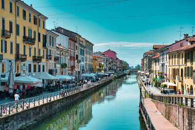 Daytime scenic view of naviglio grande, naviglio grand canal full with restaurants, bars
