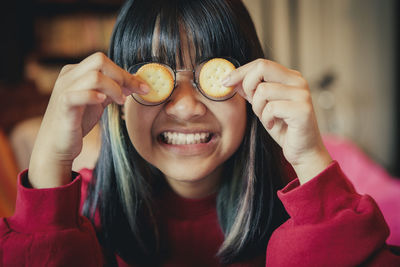 Close-up portrait of a smiling young woman