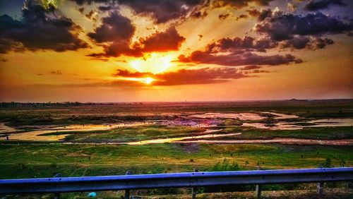 Scenic view of landscape at sunset