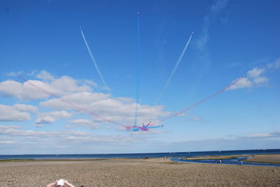 Scenic view of beach against blue sky