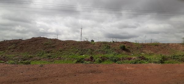 Panoramic view of field against sky