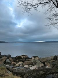 Scenic view of sea against cloudy sky