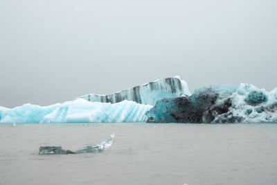 Scenic view of frozen sea against sky