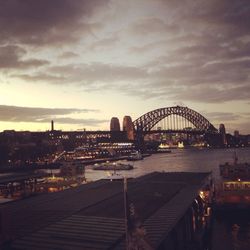 Bridge over river with city in background
