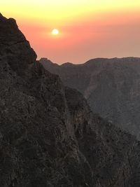 Scenic view of mountains against sky during sunset