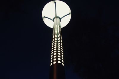 Low angle view of illuminated street light against sky at night