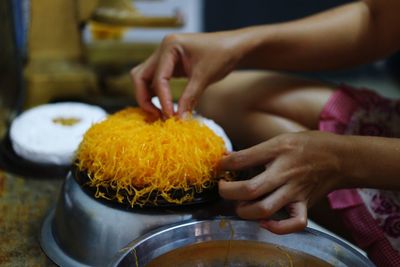 Close-up of woman preparing food