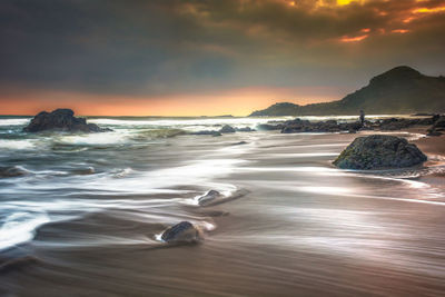 Scenic view of sea against sky during sunset