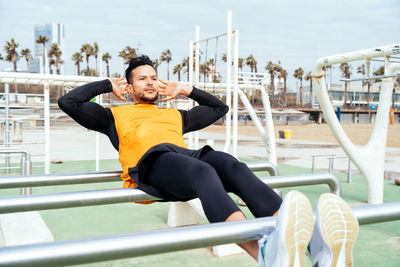 Man doing abdominal exercise at gym