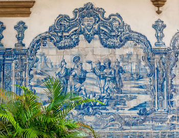 View of statues on wall of building