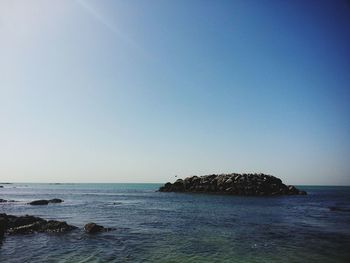 Scenic view of sea against clear sky