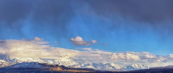 Scenic view of snowcapped mountains against sky