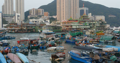 High angle view of harbor by buildings in city