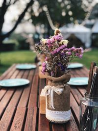 Close-up of purple flower vase on table