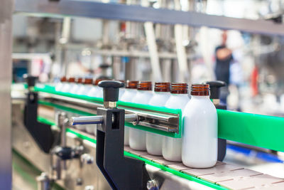 Automated assembly line for bottling and packaging liquid products in a modern industrial facility