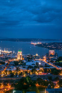 High angle view of illuminated buildings in city at night