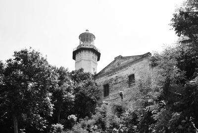 Low angle view of water tower against clear sky