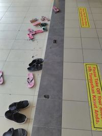 Low section of people relaxing on tiled floor