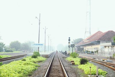 Railway tracks against clear sky