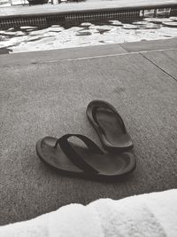 High angle view of shoes on sand at beach