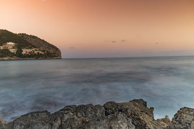 Scenic view of sea and rocks against sky