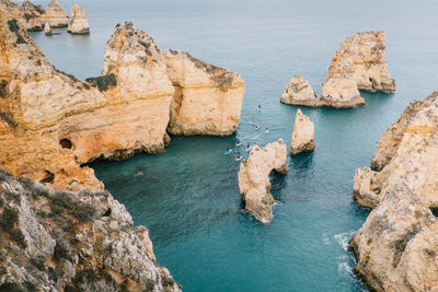 High angle view of rock formation in sea