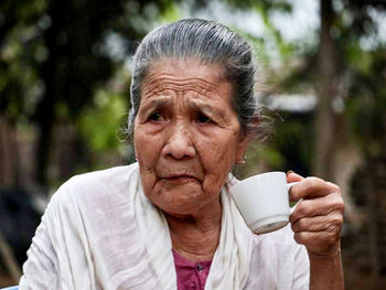 Portrait of man drinking coffee