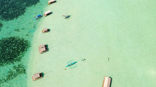 A floating native cottage on a sandbar in the tourist island of caramoan in the philippines.