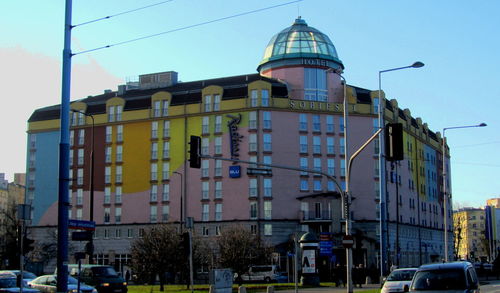 View of buildings in city against clear sky