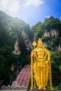 Statue of buddha against sky